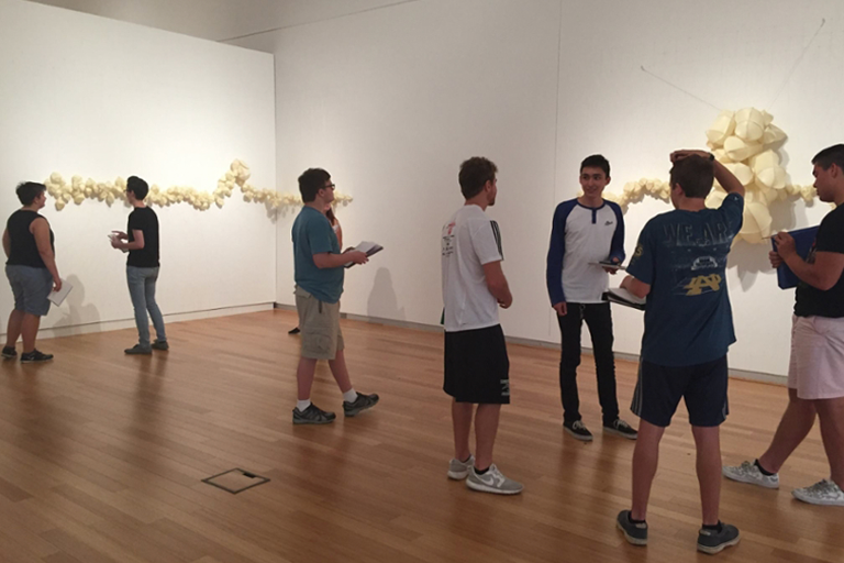 Students exploring art in a museum